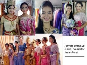 Students and other people in Cambodian dress and costume posing for pictures.