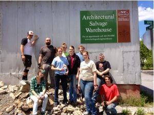 Group of people standing in front of a warehouse 