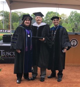 Dr. Scott Hummel, Dr. Tricia Hunsader, and Rev. Charles Hutchins dressed in graduation attire