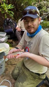 Levi Morgan, a 2020 graduate of Tusculum University with a fish