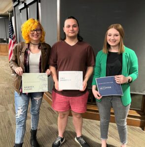 students holding awards